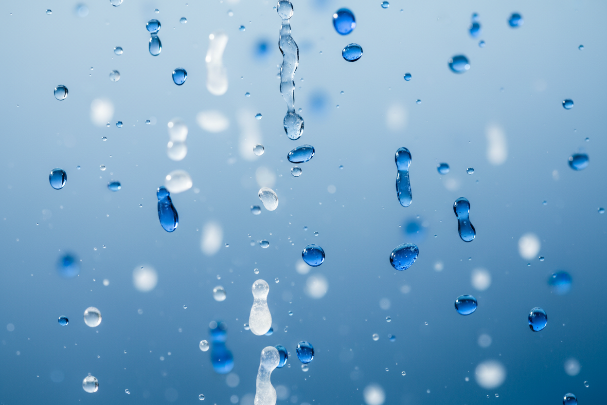 blue and white raindrops falling